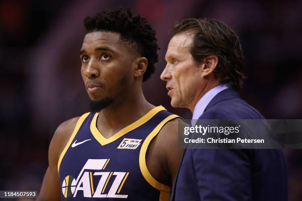 Head coach Quin Snyder of the Utah Jazz talks with Donovan Mitchell during the first half of the NBA game against the Phoenix Suns at Talking Stick...
