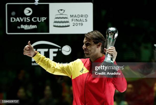 Rafael Nadal of Spain celebrates with his trophy during the ceremony after defeating Denis Shapovalov of Canada in the 2019 Davis Cup final match...