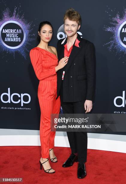 Singer Finneas O'Connell and Claudia Sulewski arrive for the 2019 American Music Awards at the Microsoft theatre on November 24, 2019 in Los Angeles.
