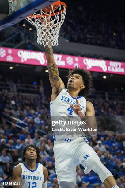 Nick Richards of the Kentucky Wildcats dunes the ball during the first half of the NCAA basketball game against the Lamar Cardinalsat Rupp Arena on...