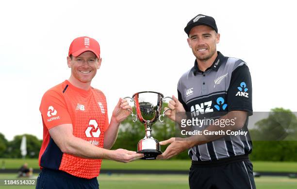 England captain Eoin Morgan and New Zealand captain Tim Southee pose with the Twenty20 International series trophy during a photocall at Hagley Park...