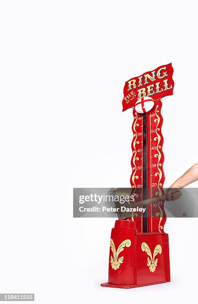 strong man bell being hit with hammer - strength tester stock pictures, royalty-free photos & images