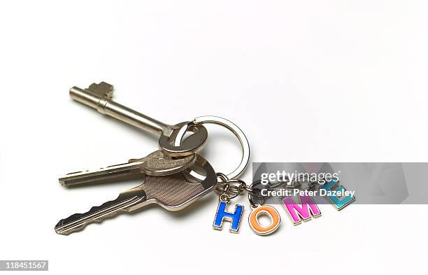 home keys with copy space - schlüsselbund anhänger stock-fotos und bilder