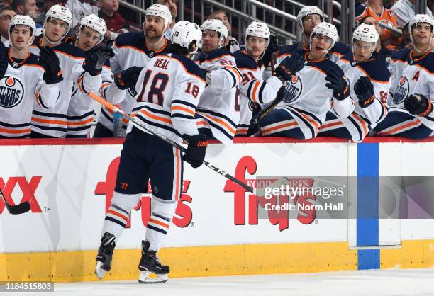 James Neal of the Edmonton Oilers is congratulated by teammates after scoring a goal against the Arizona Coyotes during the first period at Gila...