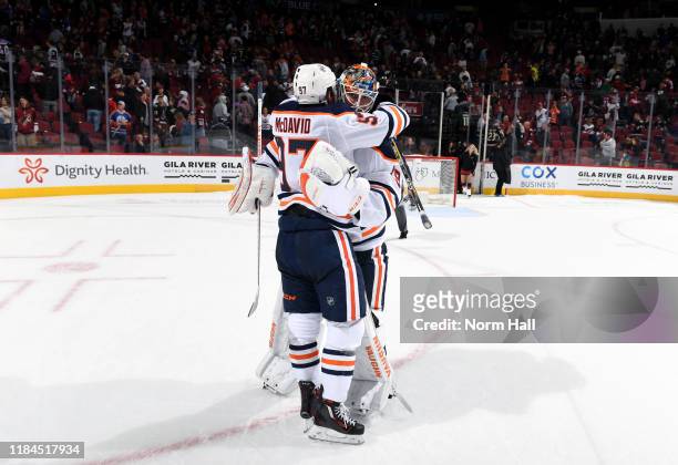 Connor McDavid of the Edmonton Oilers congratulates goalie Mikko Koskinen of the Oilers following a 4-3 shootout victory against the Arizona Coyotes...