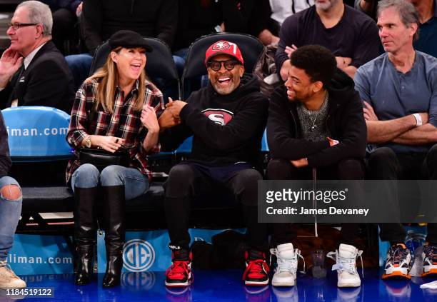 Ellen Pompeo, Spike Lee and Jackson Lee attend the Brooklyn Nets v New York Knicks game at Madison Square Garden on November 24, 2019 in New York...