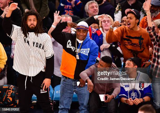 Cole, Tracy Morgan, a guest and Chris Ivery attend the Brooklyn Nets v New York Knicks game at Madison Square Garden on November 24, 2019 in New York...