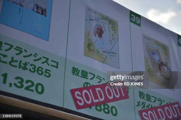 Merchandise is seen at a shop outside the Tokyo Dome stadium ahead of a holy mass led by Pope Francis in Tokyo on November 25, 2019.