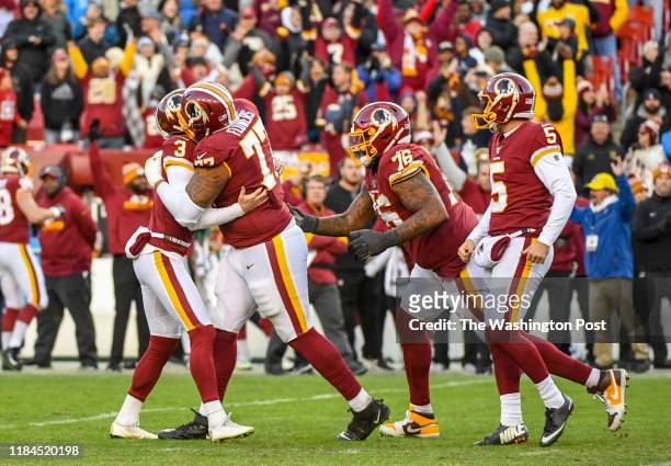 Washington Redskins offensive guard Ereck Flowers starts the celebration with kicker Dustin Hopkins after he nailed the game winning field goal for a...