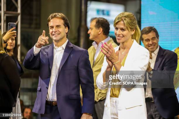 Luis Lacalle Pou, presidential candidate for the National Party and his wife Lorena Ponce de Leon are seen during the event in Montevideo. This...
