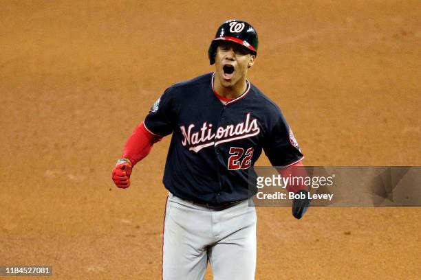 Juan Soto of the Washington Nationals celebrates as he comes home to score a run on a home run by Howie Kendrick against the Houston Astros during...