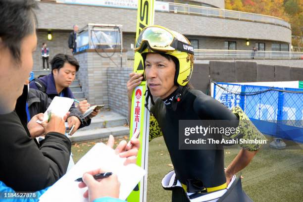 Noriaki Kasai speaks to media after competing in the Men's competition on day two of the 98th All Japan Ski Championships Ski Jumping competitions at...