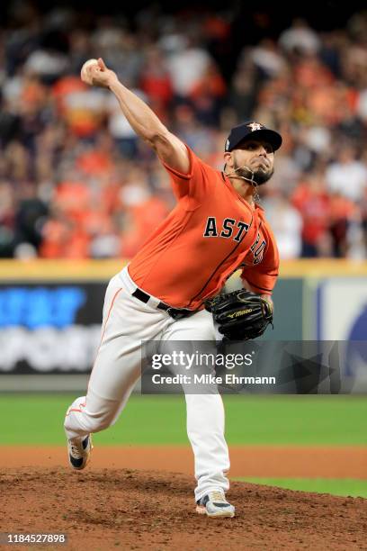 Roberto Osuna of the Houston Astros delivers the pitch against the Washington Nationals during the seventh inning in Game Seven of the 2019 World...