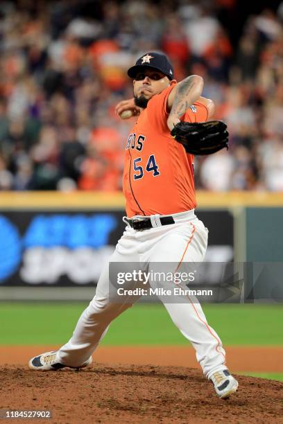 Roberto Osuna of the Houston Astros delivers the pitch against the Washington Nationals during the seventh inning in Game Seven of the 2019 World...