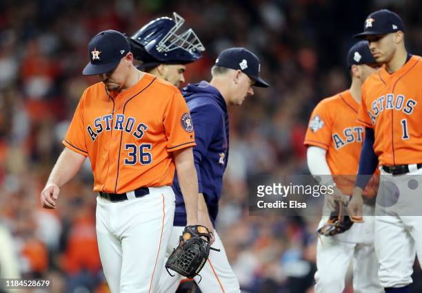 Will Harris of the Houston Astros reacts after allowing a two-run home run to Howie Kendrick of the Washington Nationals during the seventh inning in...