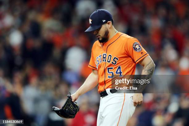 Roberto Osuna of the Houston Astros reacts against the Washington Nationals during the eighth inning in Game Seven of the 2019 World Series at Minute...