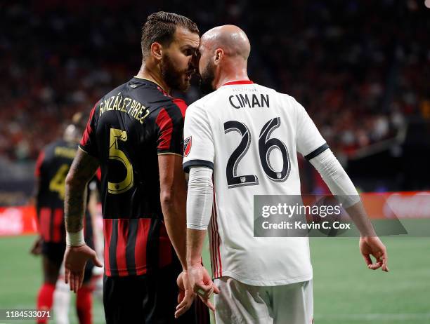 Leandro Gonzalez Pirez of Atlanta United and Laurent Ciman of Toronto FC confront each other in the second half during the Eastern Conference Finals...