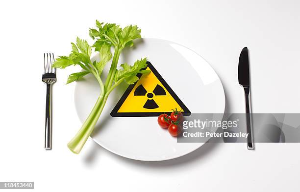 radioactive food on plate - toxin stock pictures, royalty-free photos & images