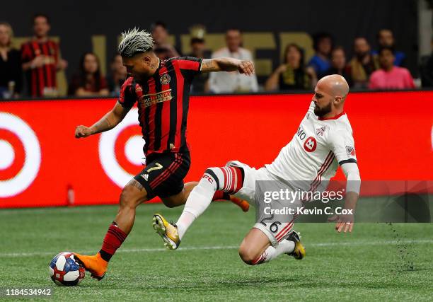 Laurent Ciman of Toronto FC defends against a shot on goal by Josef Martinez of Atlanta United in the second half during the Eastern Conference...
