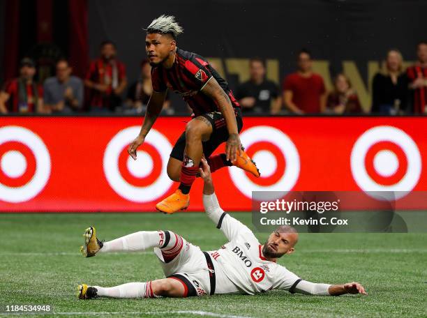 Laurent Ciman of Toronto FC defends against a shot on goal by Josef Martinez of Atlanta United in the second half during the Eastern Conference...