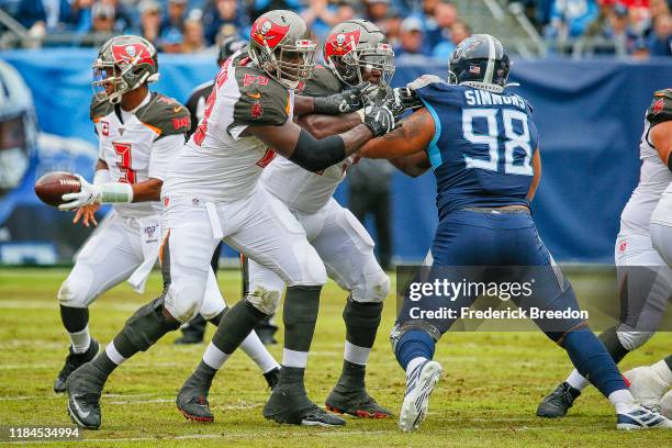 Demar Dotson of the Tampa Bay Buccaneers blocks Jeffery Simmons of the Tennessee Titans at Nissan Stadium on October 27, 2019 in Nashville, Tennessee.