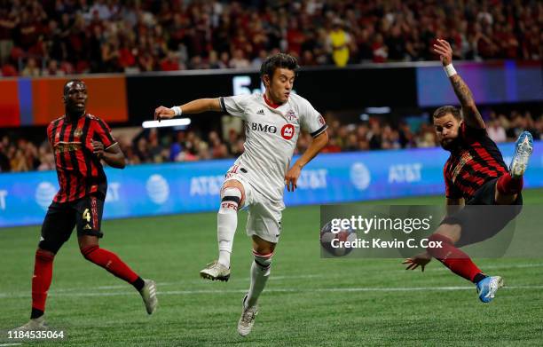 Leandro Gonzalez Pirez of Atlanta United attempts to clear a pass intended for Tsubasa Endoh of Toronto FC in the first half during the Eastern...