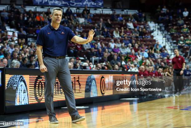 Virginia Cavaliers head coach Tony Bennett gestures to his players during the college basketball game between Virginia Cavaliers and UMass Minutemen...