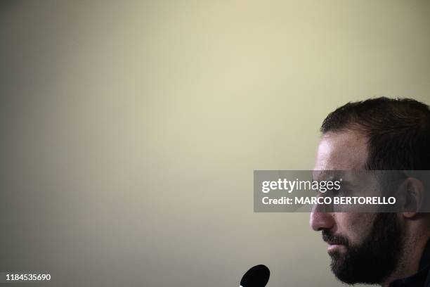 Juventus' Argentinian forward Gonzalo Higuain speaks during a press conference on November 25, 2019 at the Juventus Allianz stadium in Turin, on the...