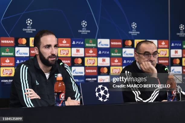 Juventus' Argentinian forward Gonzalo Higuain and Juventus' Italian coach Maurizio Sarri hold a press conference on November 25, 2019 at the Juventus...