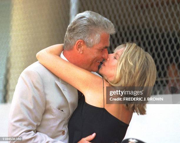 Singer and actress Barbra Streisand gives her husband actor James Brolin a kiss during his Hollywood star installation on the Walk of Fame in...