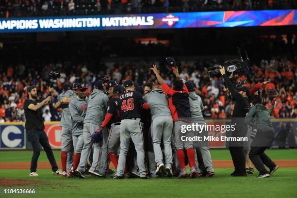 The Washington Nationals celebrate after defeating the Houston Astros in Game Seven to win the 2019 World Series at Minute Maid Park on October 30,...