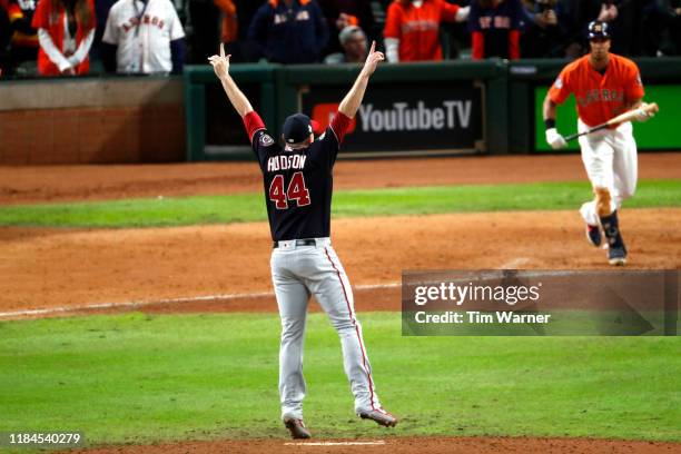 Daniel Hudson of the Washington Nationals celebrates after striking out Michael Brantley of the Houston Astros to win Game Seven 6-2 to win the 2019...