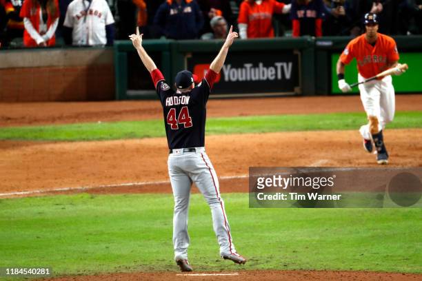 Daniel Hudson of the Washington Nationals celebrates after striking out Michael Brantley of the Houston Astros to win Game Seven 6-2 to win the 2019...