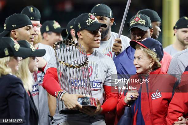 Juan Soto of the Washington Nationals holds the Commissioners Trophy after defeating the Houston Astros 6-2 in Game Seven to win the 2019 World...