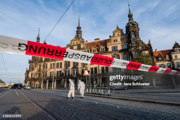 Criminal police investigate the environment outside the Residenzschloss palace that houses the Gruenes Gewoelbe collection of treasures on November...