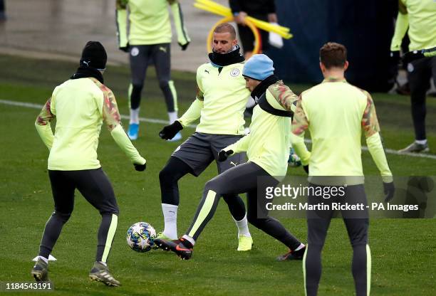 Manchester City's Kyle Walker and Nicolas Otamendi during the training session at the City Football Academy, Manchester.