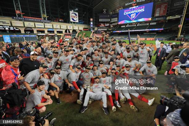 The Washington Nationals celebrate after defeating the Houston Astros in Game Seven to win the 2019 World Series at Minute Maid Park on October 30,...