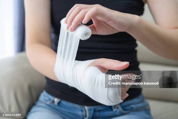 wounds at the wrist,bandages a hand wound pain medicine - bandage imagens e fotografias de stock