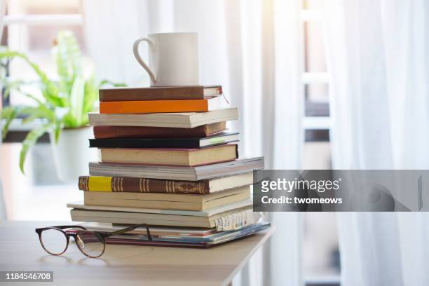 stack of books and coffee cup. - textbook stack stock pictures, royalty-free photos & images