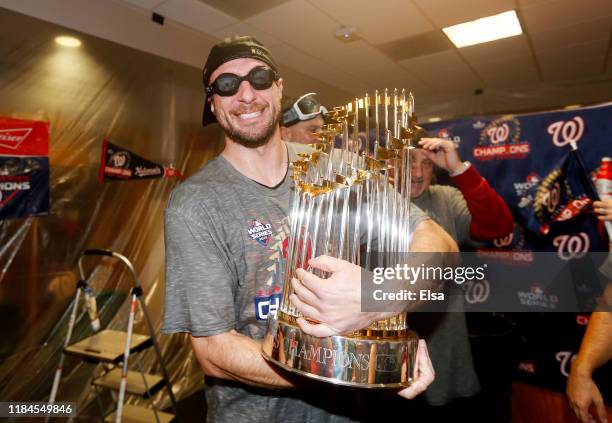Max Scherzer of the Washington Nationals celebrates in the locker room after defeating the Houston Astros in Game Seven to win the 2019 World Series...