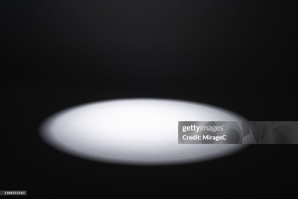 Illuminated Spotlight in the Dark