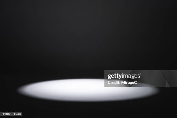 illuminated spotlight in the dark - stage light black background stock pictures, royalty-free photos & images