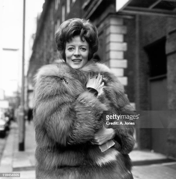 Maggie Smith, British actress, wearing a fur coat as she poses for a portrait, in January 1969.