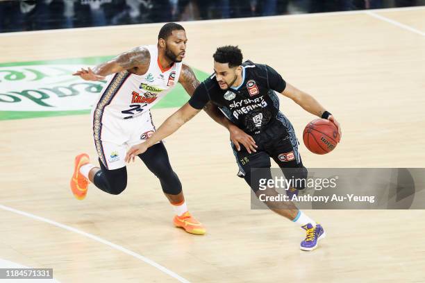 Corey Webster of the Breakers drives against DJ Newbill during the round five NBL match between the New Zealand Breakers and the Cairns Taipans at...