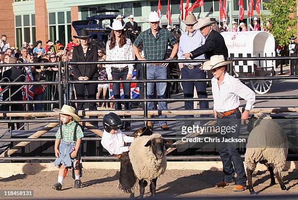 Catherine, Duchess of Cambridge and Prince William, Duke of Cambridge watch a demonstration during a Government Reception at the BMO Centre on July...