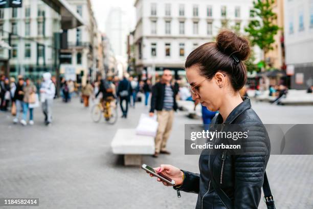 woman on brussels town square - brussels square stock pictures, royalty-free photos & images