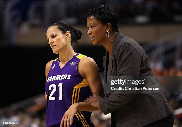 Ticha Penicheiro and head coach Jennifer Gillom of the Los Angeles Sparks during the WNBA game against the Phoenix Mercury at US Airways Center on...