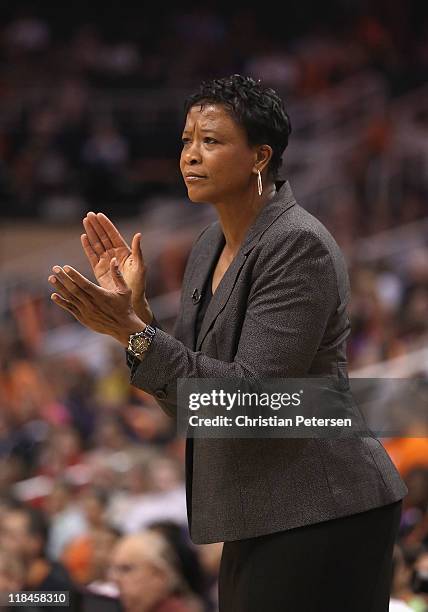 Head coach Jennifer Gillom of the Los Angeles Sparks reacts during the WNBA game against the Phoenix Mercury at US Airways Center on July 5, 2011 in...