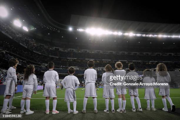 Group of children wearing Real Madrid outfit attend their team´s warming up before the Liga match between Real Madrid CF and CD Leganes at Estadio...