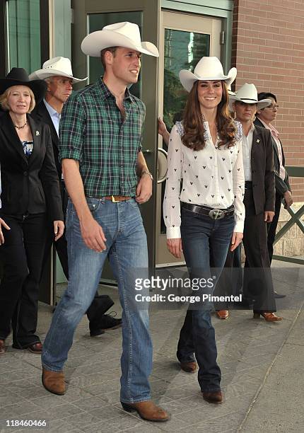 Prince William, Duke of Cambridge and Catherine, Duchess of Cambridge watch traditional Calgary Stampede activities at the BMO Centre on July 7, 2011...